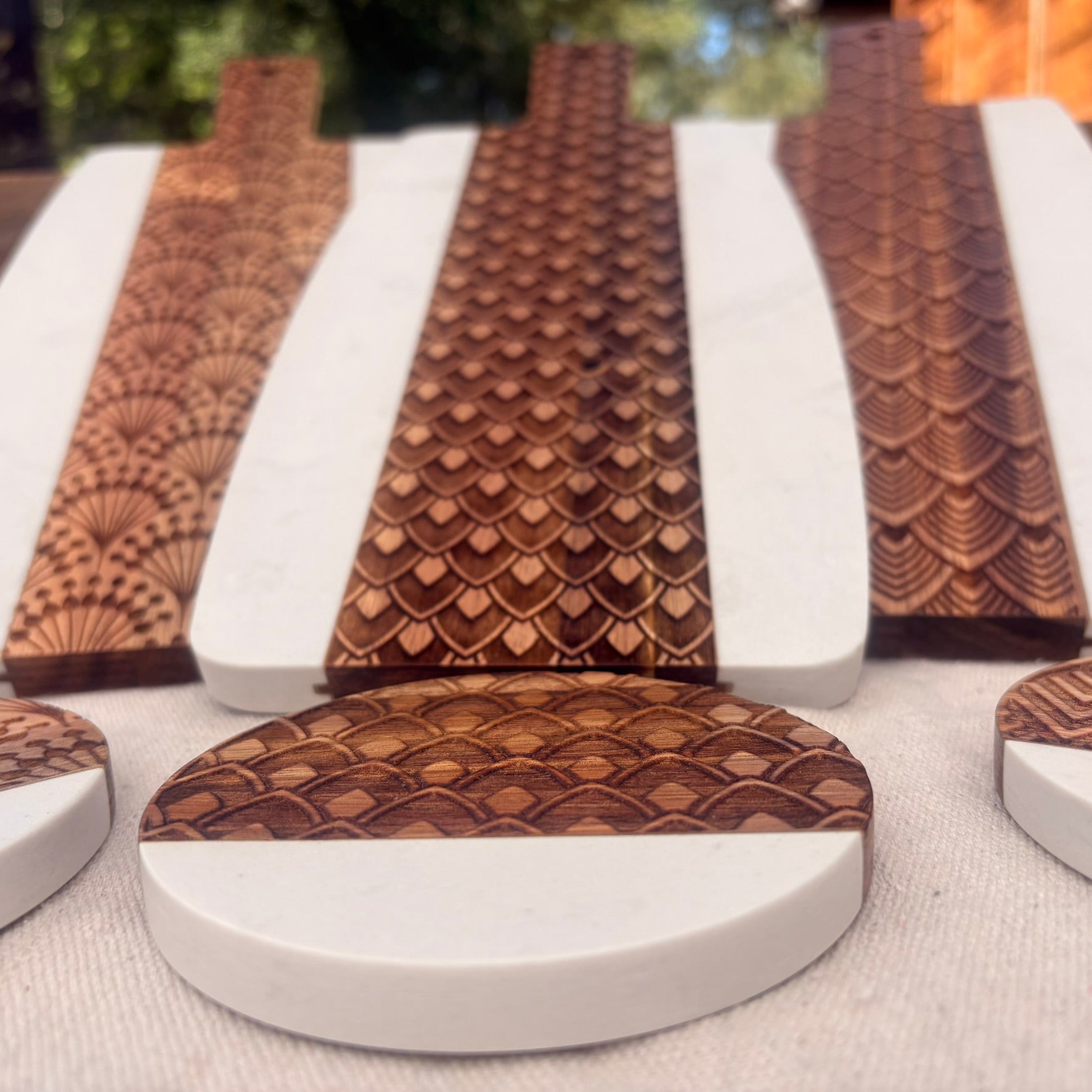 matching coasters and serving board with a geometric pattern.